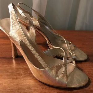 Gold Nine West strappy sandals by Nine West.
